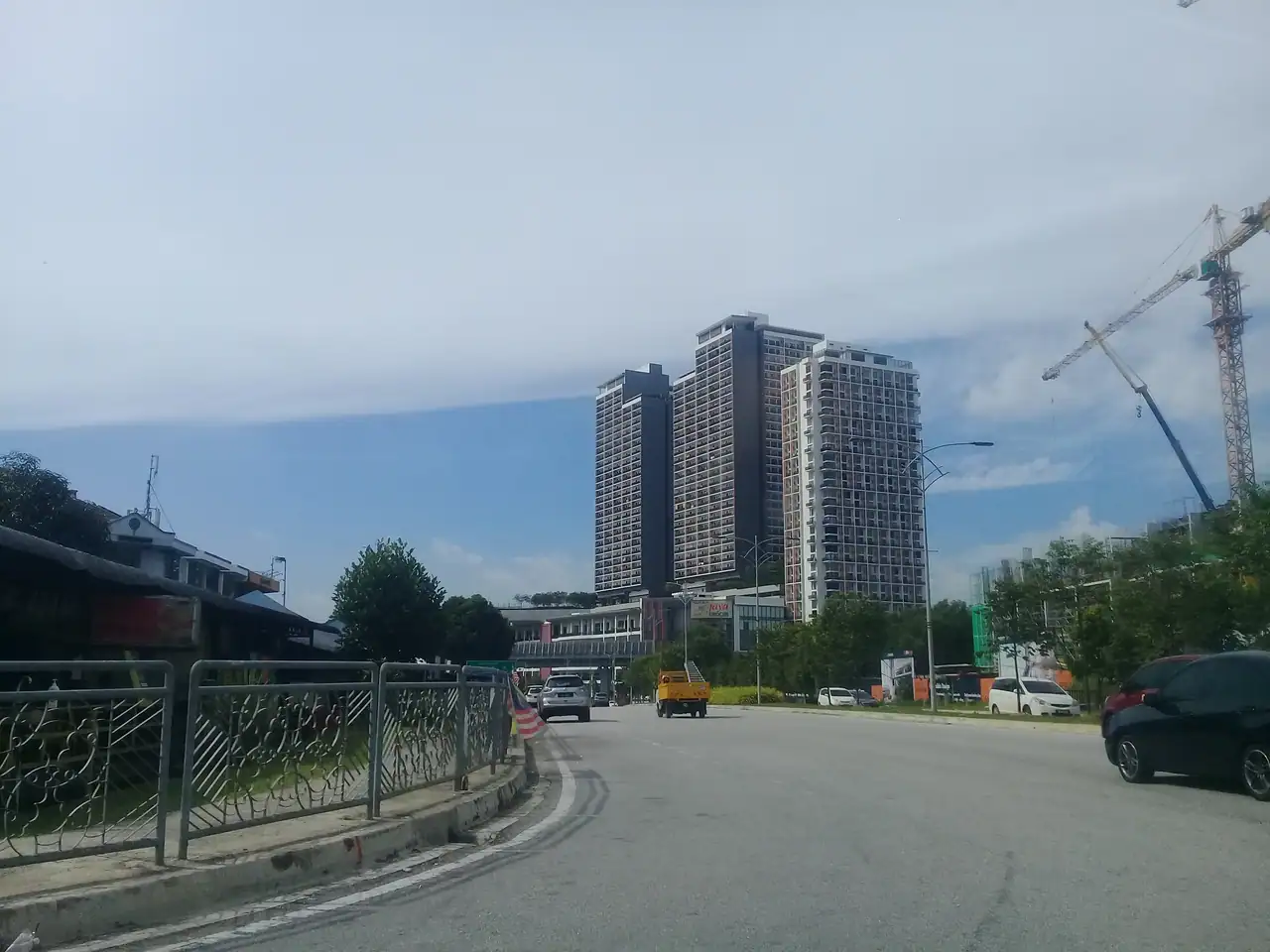 Emporis towers seen from the access road with a crane still on the neighbouring site
