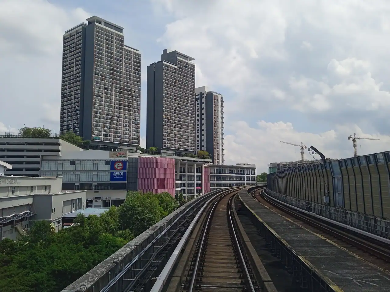 Two Emporis towers seen from the Kajang line track between Kota Damansara MRT station and Kwasa Sentral