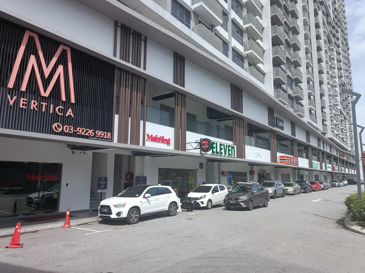 Ground-level shops under M Vertica with the M Vertica sign