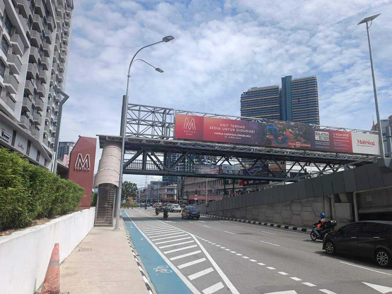 Covered pedestrian bridge over Jalan Cheras beside the M Vertica billboard