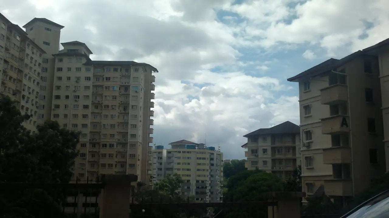 Several Oakleaf Park blocks of different heights behind trees