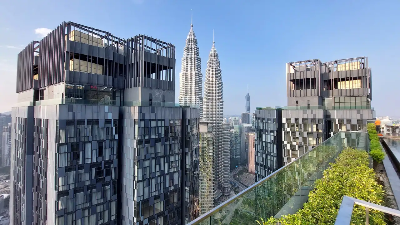 Rooftop terrace planting at Star Residences Tower One with Star Residences Towers Two and Three and the Petronas Twin Towers beyond