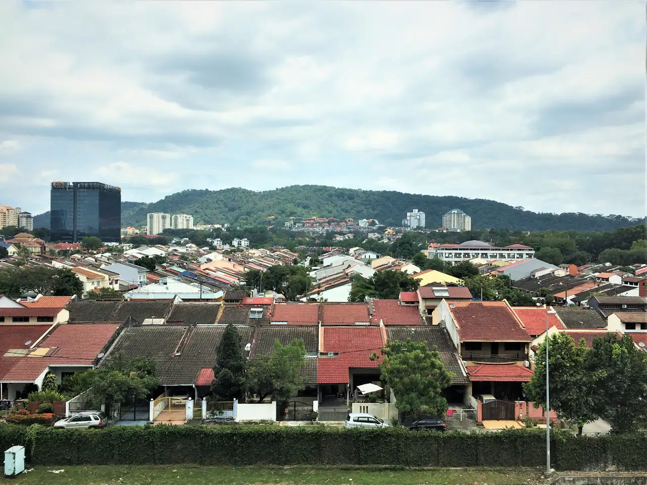 Rows of red-roofed terrace houses in the Jalan Burhanuddin Helmi area of Taman Tun Dr Ismail seen from above
